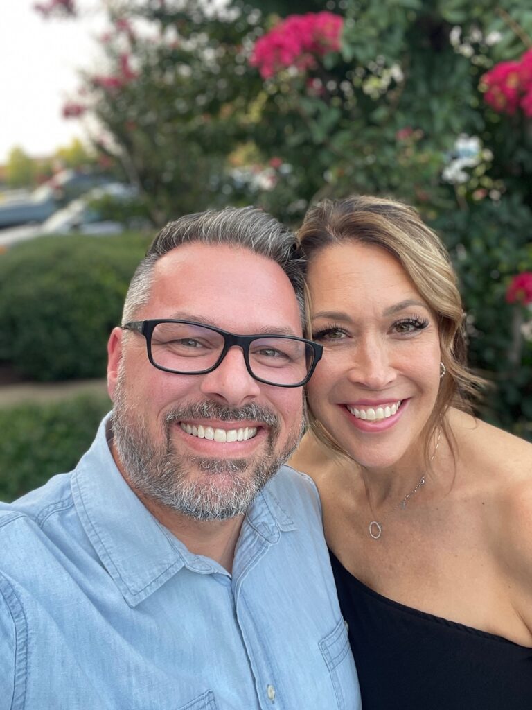 selfie of man and woman beside bush showing date nights matter