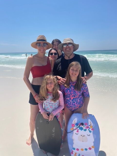 family of six posing at the beach in Destin, Florida