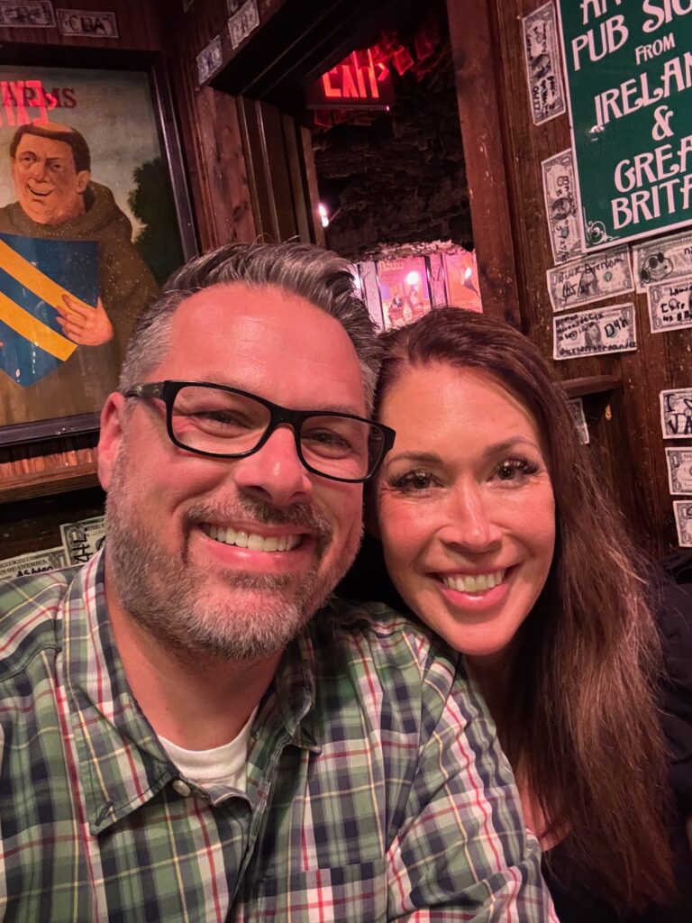 Man and woman sitting in booth at McGuires Irish Pug restaurant